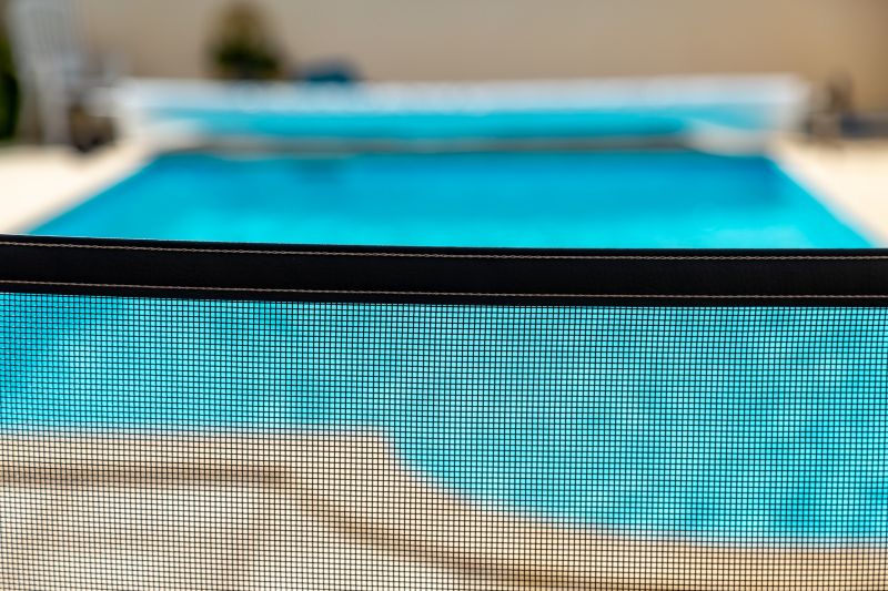 Pool with Mesh Safety Barrier